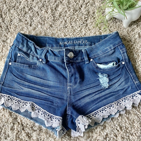Almost Famous Pants - Almost famous dark blue distressed fringy floral edged denim short short…